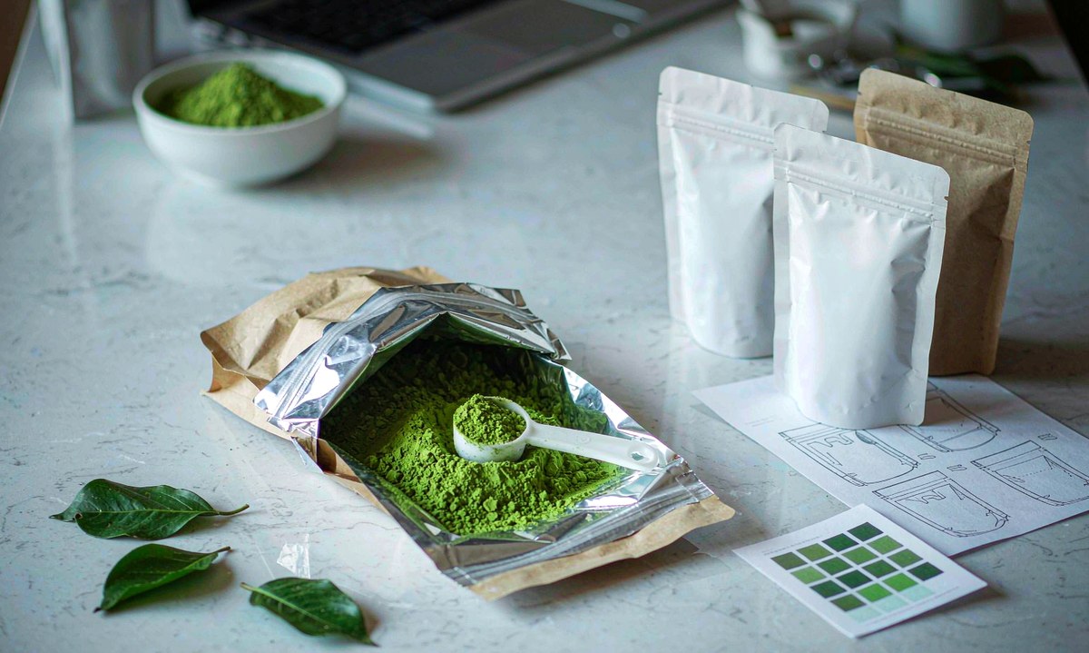 Blank pouches and label proofs prepared for a private-label matcha project